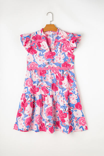 Vestido rosa con estampado floral, escote en V y mangas acampanadas